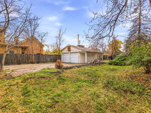 View of yard featuring a garage