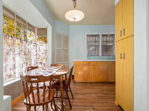 Dining space with plenty of natural light and light wood-type flooring