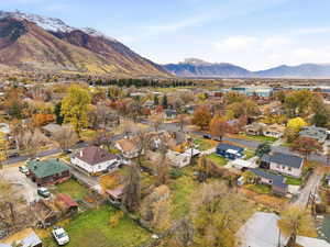 Aerial view of residential area featuring a mountainous background