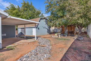 View of yard featuring a patio area and an outbuilding
