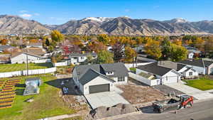 Aerial perspective of suburban area featuring a mountain backdrop