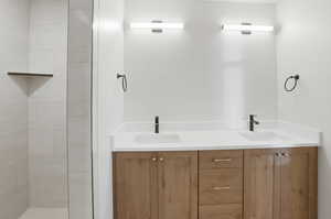 Primary suite bathroom featuring double vanity
