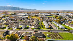 Aerial view of residential area featuring a mountainous background
