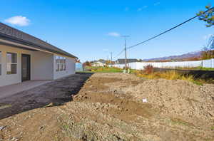 View of yard with a patio area and a mountain view