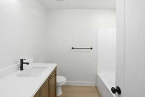 Guest/ Bedroom full bathroom featuring vanity, light wood finished floors, and bathtub / shower combination