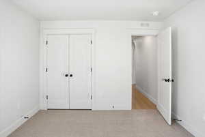 Bedroom 3 Unfurnished bedroom featuring light colored carpet and a closet