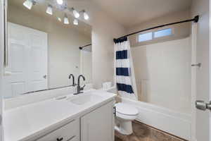 Bathroom with vanity and shower / bath combo
