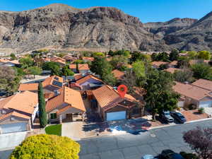 Aerial view of residential area featuring a mountainous background
