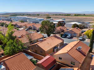 Aerial view of residential area featuring a mountain backdrop