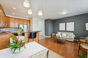 Living room featuring light wood-style flooring and recessed lighting