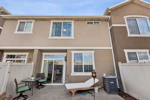 Back of house featuring stucco siding and a patio area