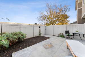 Fenced backyard with a patio