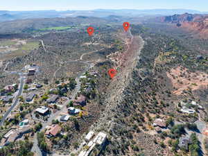 Aerial view of property's location with a mountainous background and a desert landscape