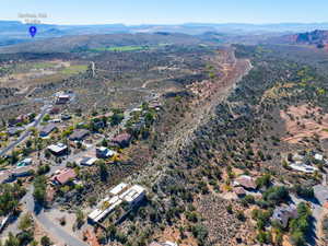 Aerial overview of property's location featuring a mountain backdrop and a desert landscape