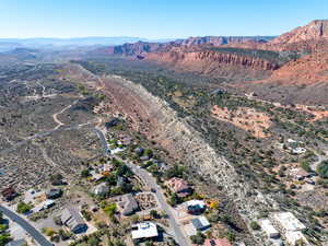 View of property location featuring a mountainous background and a desert landscape