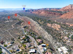 View of property location featuring a mountainous background and a desert landscape