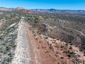 Overview of rural landscape featuring a mountain backdrop