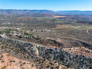 Overview of rural landscape with a mountain backdrop and a desert landscape