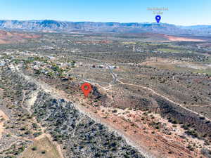 Overview of rural landscape featuring a mountainous background and a desert landscape