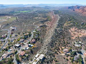 Aerial overview of property's location featuring a mountain backdrop and a desert landscape