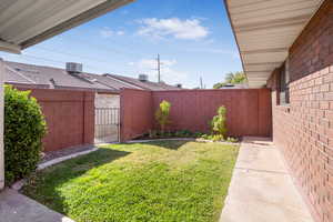 Fenced backyard with a gate