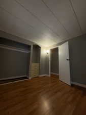 Unfurnished bedroom with light wood-style flooring and a closet