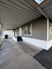 View of patio / terrace with a carport