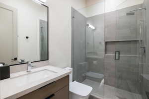Bathroom with vanity and a stall shower