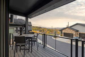 Balcony featuring outdoor dining space and a mountain view