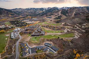 Aerial view at dusk of golf course view, a residential view, and a mountain view