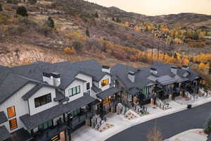 Aerial view of residential area featuring a mountainous background