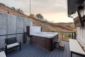 Wooden terrace with a hot tub