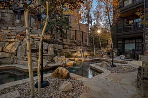 View of swimming pool featuring a jacuzzi and a patio area