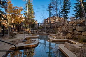 Surrounding community with a patio area and a swimming pool