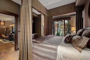 Bedroom featuring a chandelier and carpet flooring
