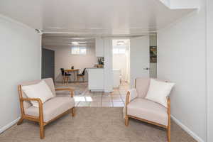 Living area featuring light tile patterned floors