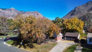 Aerial View of home looking East with  mountain and canyon backdrop.