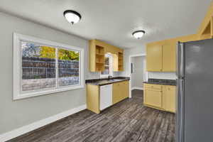 Kitchen with large window near the eat-in area.