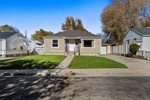 Bungalow-style house featuring concrete driveway and a garage