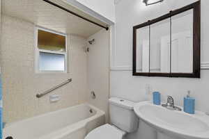 Bathroom with a sink and  shower combination