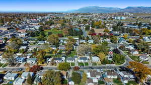 Aerial view of property's location featuring nearby suburban area and a mountain backdrop