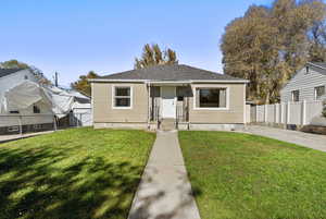 Bungalow-style house with a shingled roof