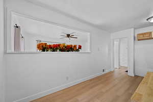 Unfurnished bedroom featuring wood finished floors and baseboards