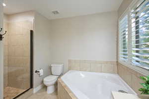 Full bathroom with a garden tub, light tile patterned floors, a shower stall, and recessed lighting