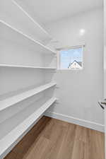 Walk in closet featuring light wood-type flooring