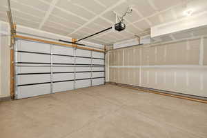 Garage featuring a garage door opener