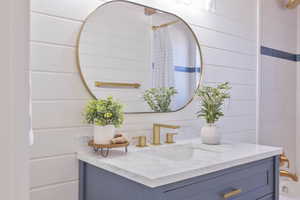 Full bath featuring vanity and a shower with shower curtain