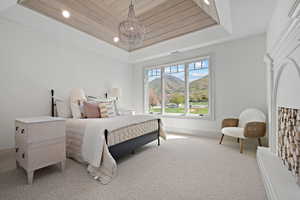 Bedroom featuring a mountain view, wooden ceiling, recessed lighting, carpet, and a chandelier