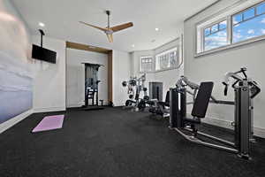 Workout area with ceiling fan and recessed lighting