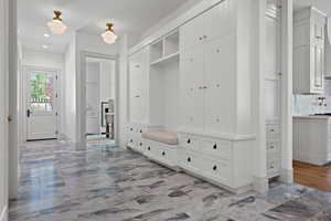 Mudroom with baseboards and recessed lighting